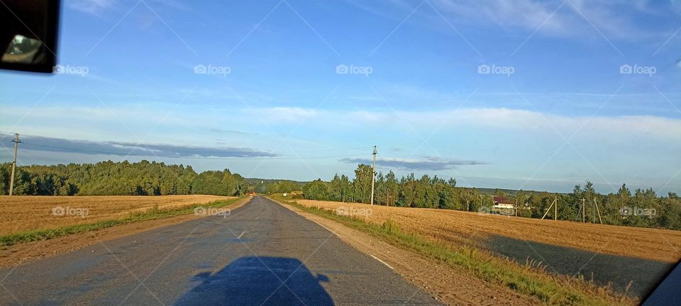 summer nature landscape road view blue sky background and shadows car