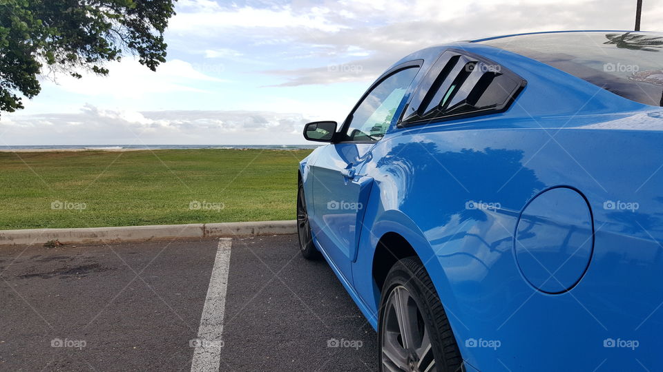 Muscle and Beaches. Sometimes you don't need to leave your car to enjoy the view in Hawaii.