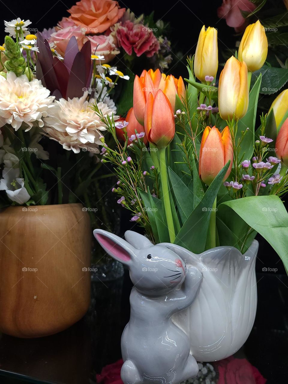 spring flowers in a bunny vase, blooms honoring the end of winter and Easter coming