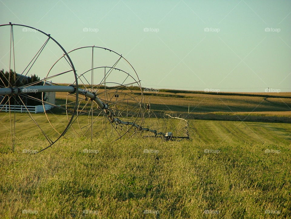 Wheel Line. a wheel line sits in a field after harvest.