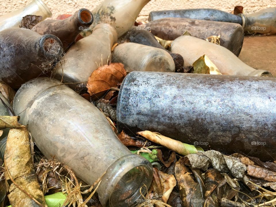 Pile antique old vintage broken dirty grungy bottles 