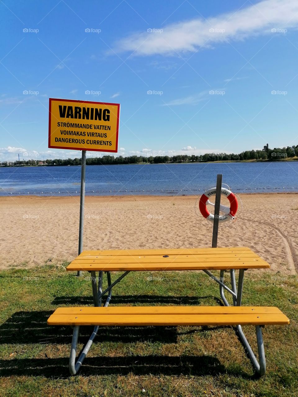 On a trip to Sweden, Haparanda. On the beach, a sign warns of deep water.