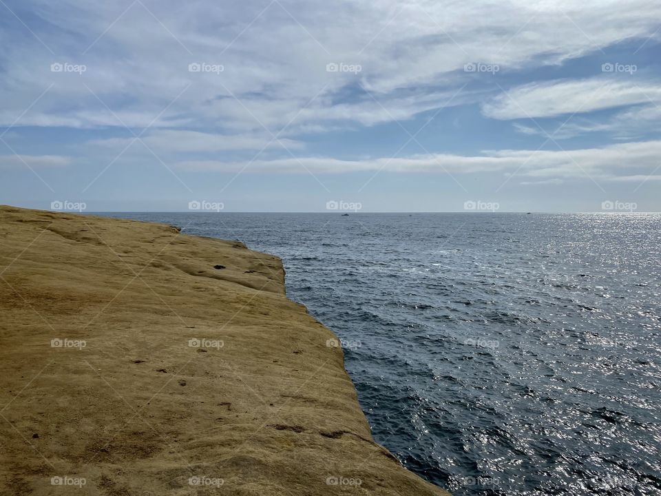 Walking along the rocks at Sunset Cliffs in San Diego California 