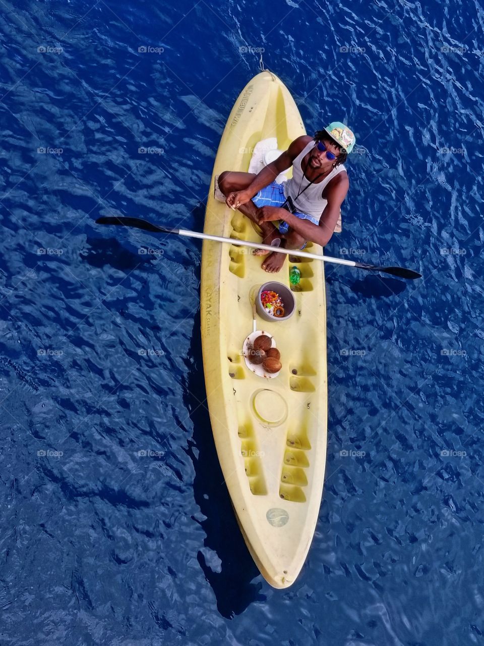 This islander was waiting for our ship to drop anchor for swim time..so that he could try and come aboard to sell items..