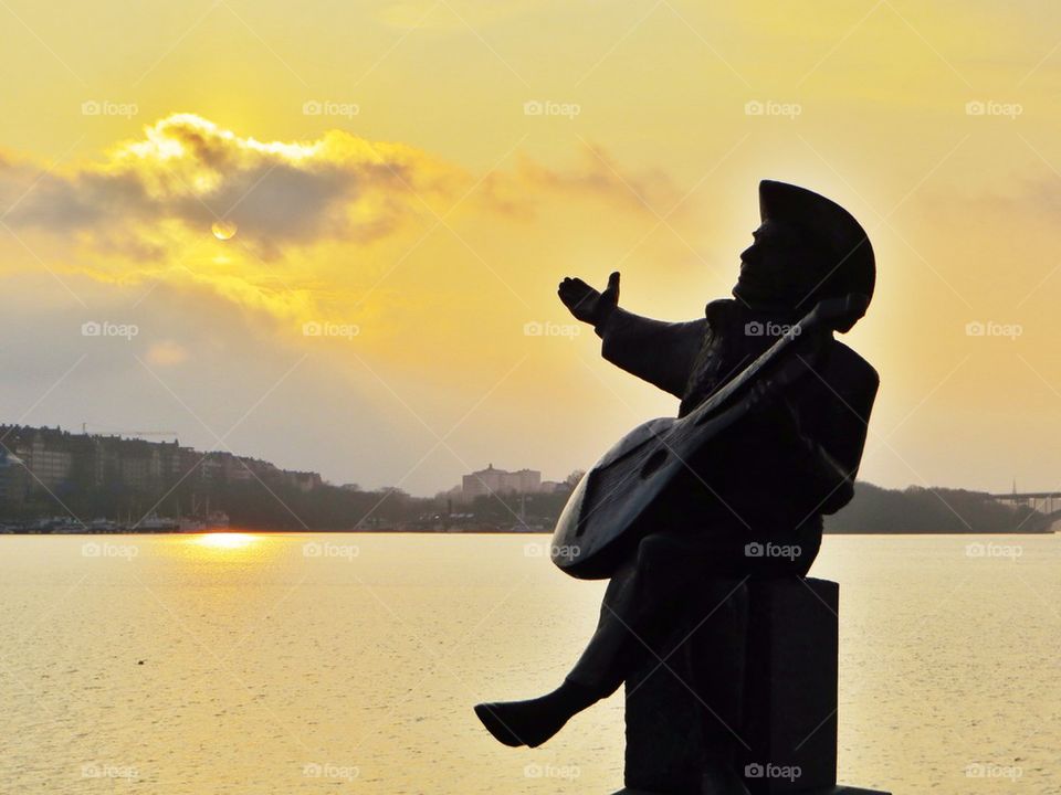 Musician by the water