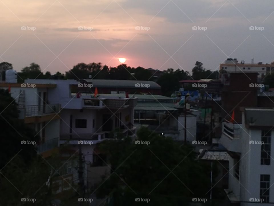 Beauty of the setting sun in a clouded sky