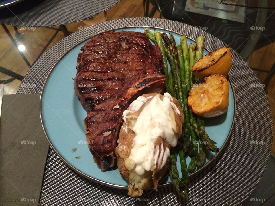 Grilled steak with potato and asparagus