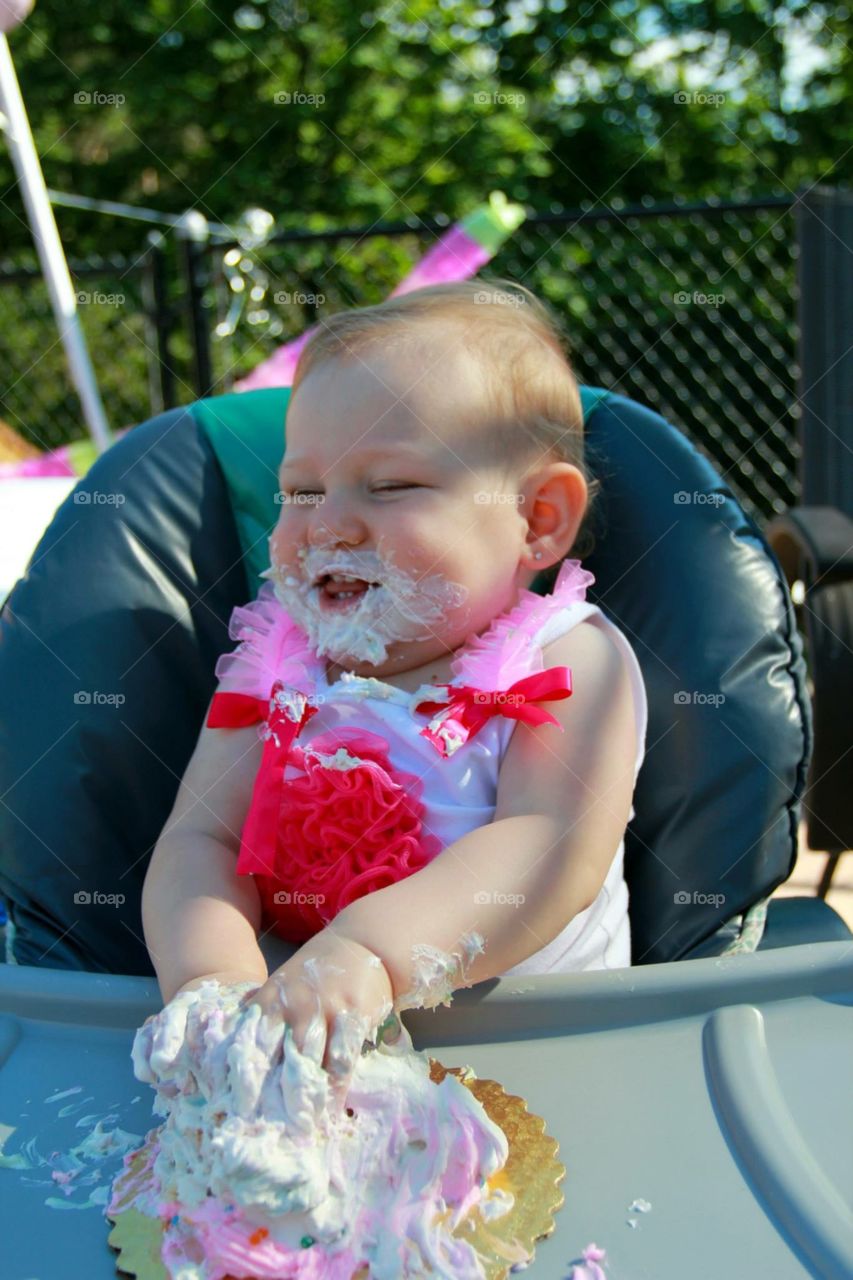 Smashing cake during birthday party 