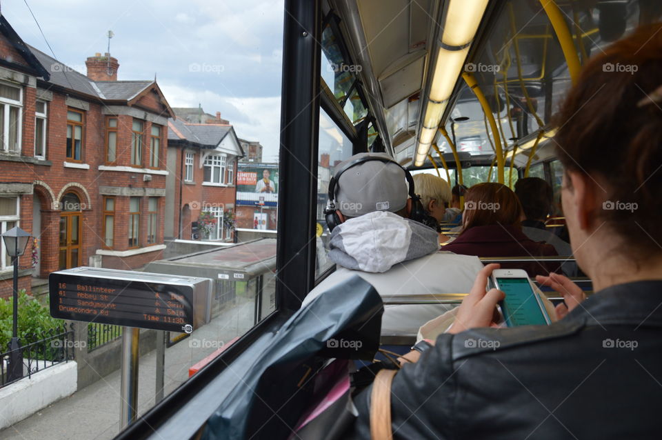 traveling by bus distracting yourself with the phone or headphones