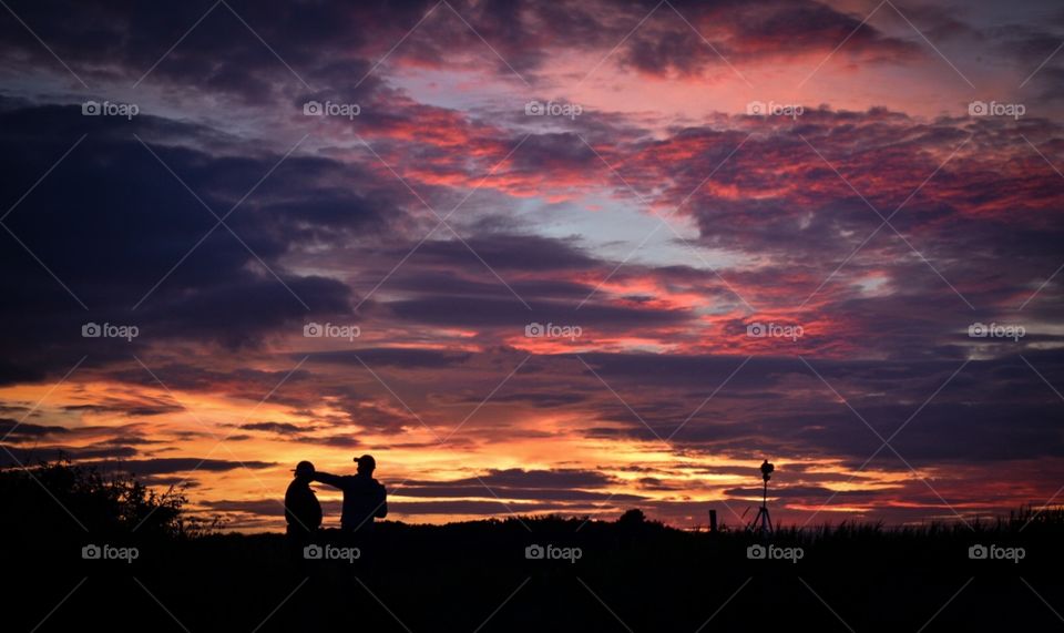 Photographer agains sunset