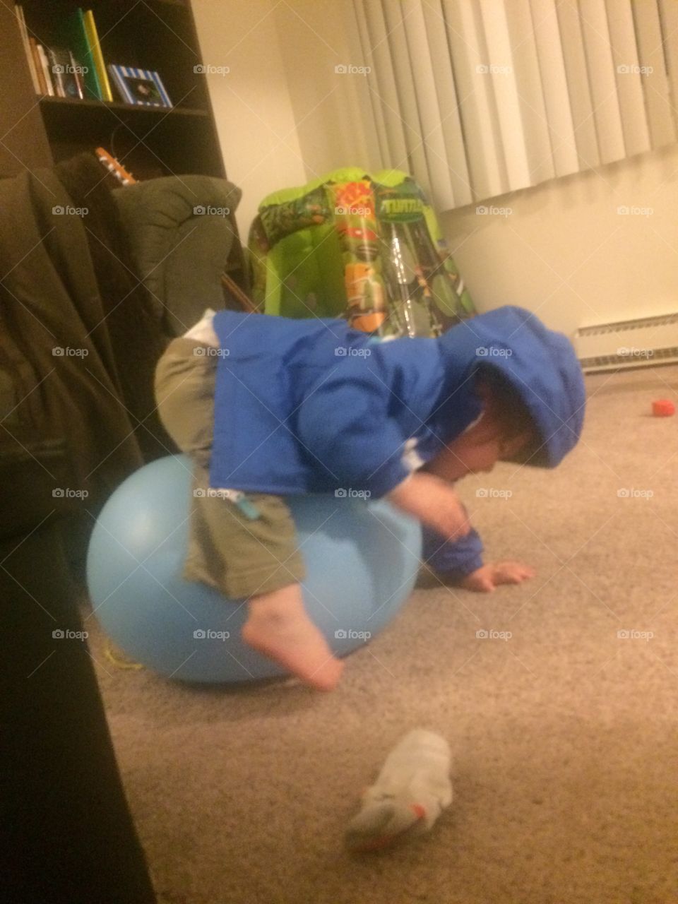 Baby stuck balancing on a ball