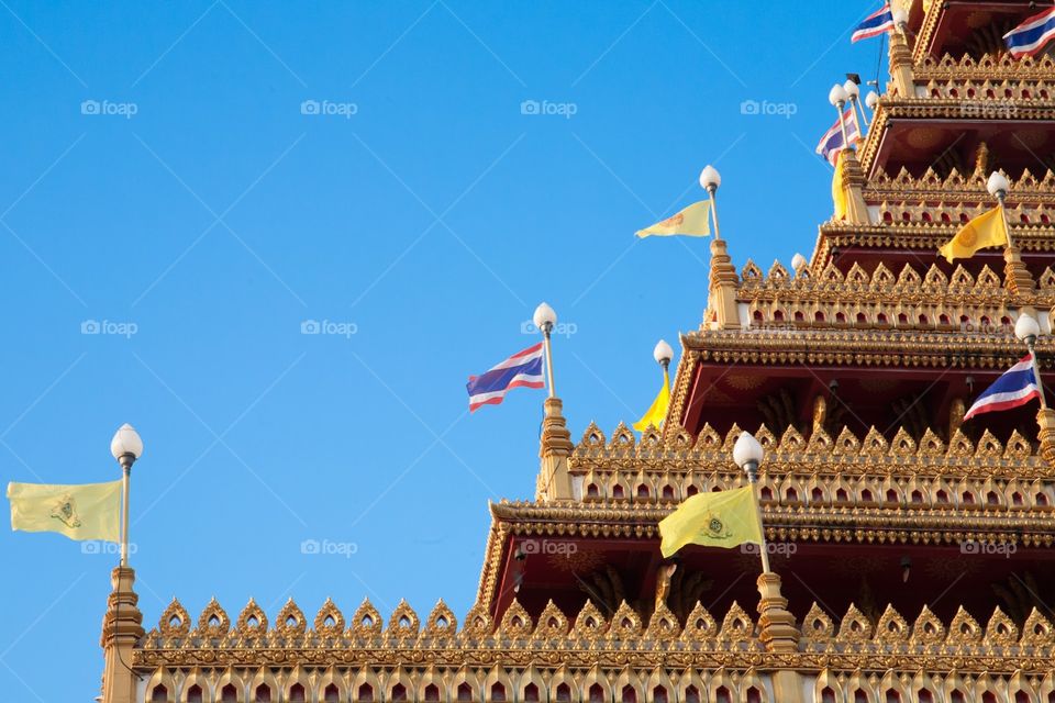 Closed up of Thai pagoda in the clear blue sky