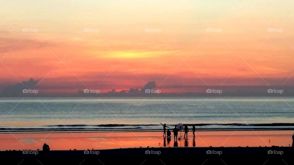 Sky Fire. This is an original samsung note 3 photo, on Daytona Beach Florida during a summer morning.