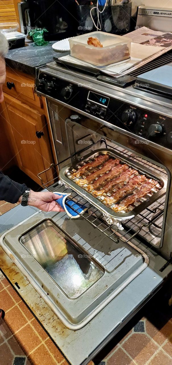 Recipe: Baked bacon strips. Preheat oven 400°, place regular cut bacon on broiler pan (coat with nonstick spray 1st). Bake 19 min. or until you prefer it. I use a convection oven.