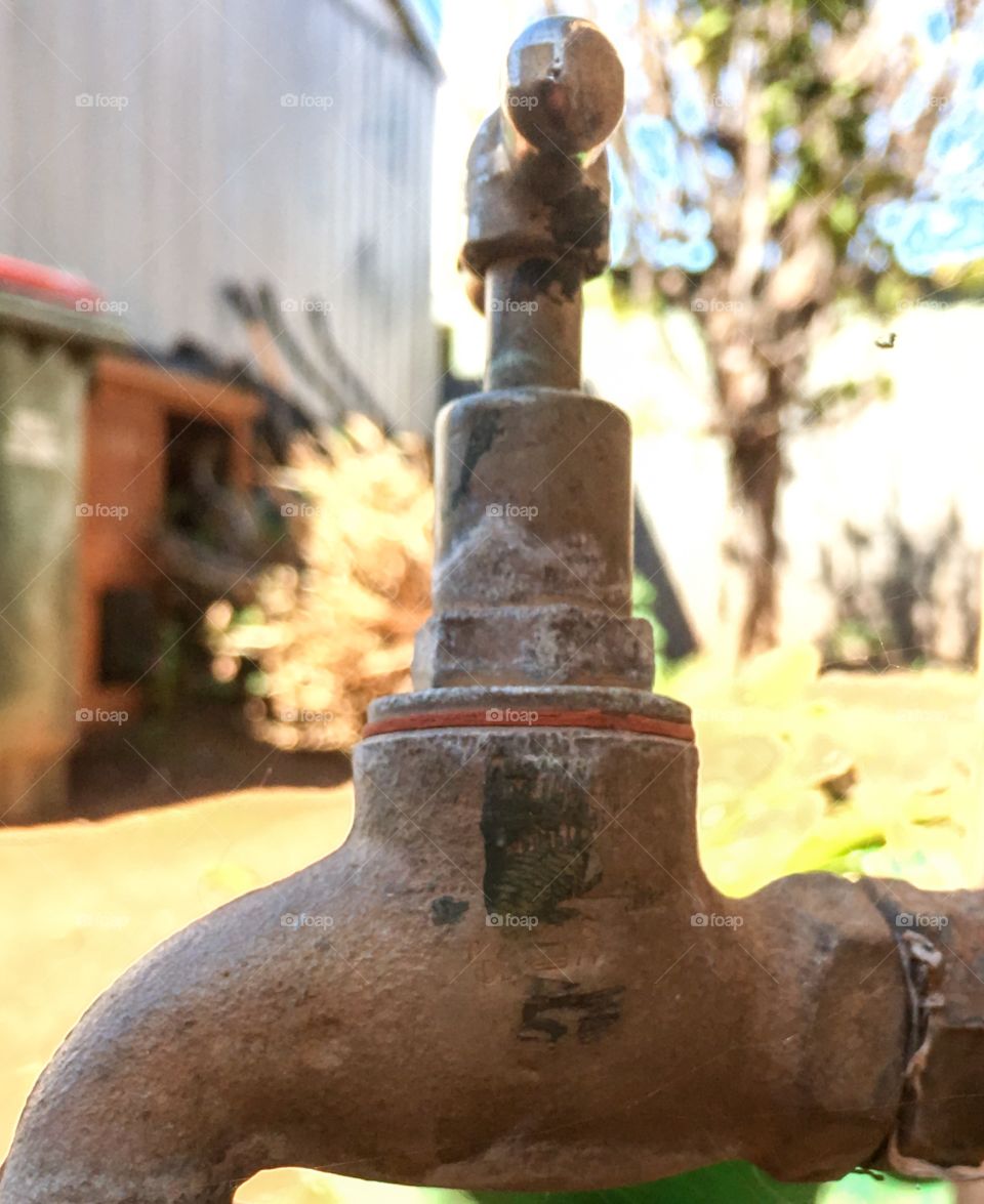 Closeup original antique iron garden faucet tap