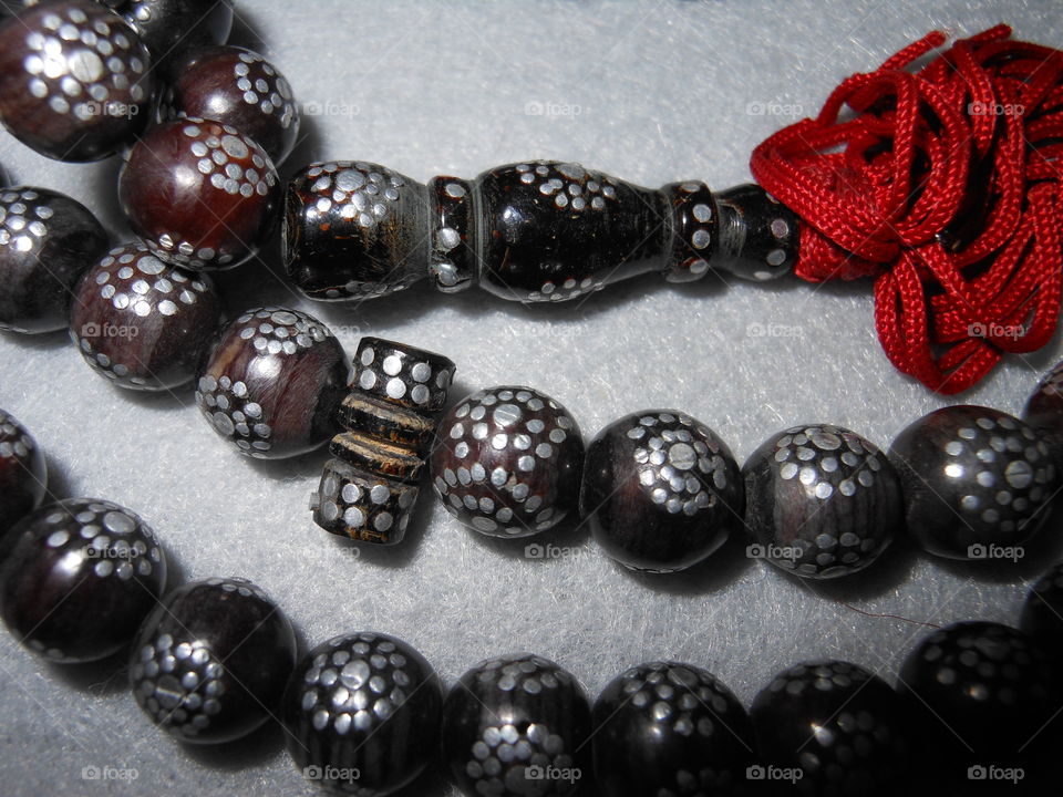 Inlaid prayer beads close up 