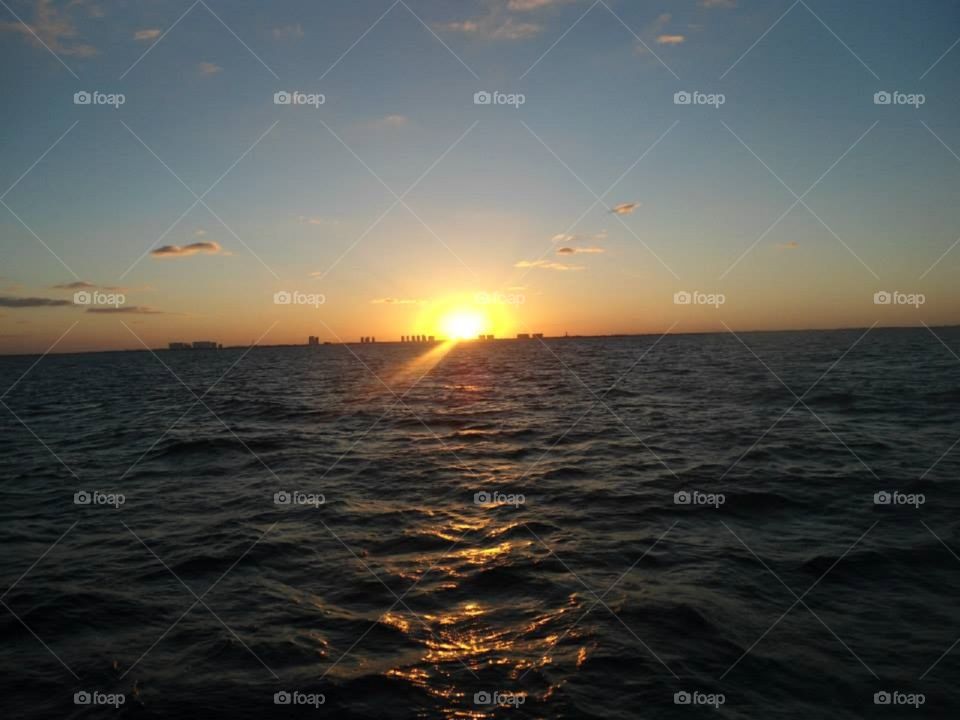 Sunset on Cancun . This was taken from a boat heading back to Cancun after scuba diving and seeing dolphins!