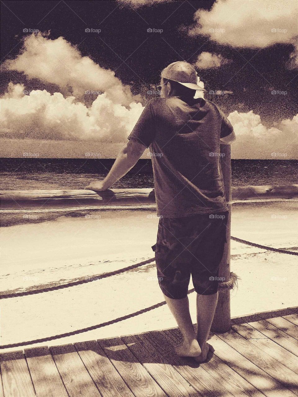 a cloudy day at the beach on the boardwalk