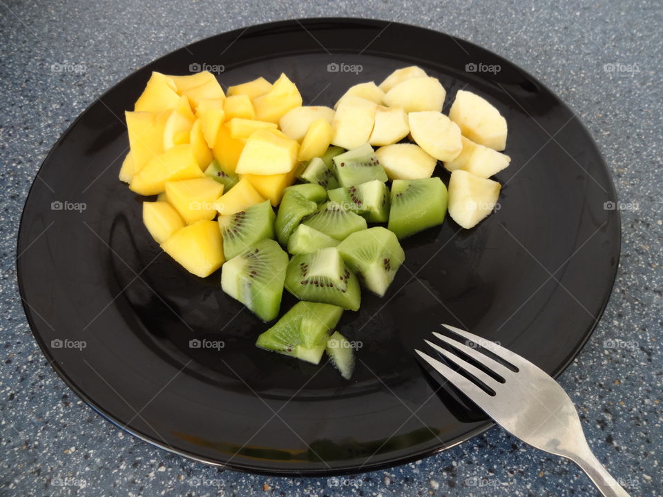 Close-up of fruits in plate