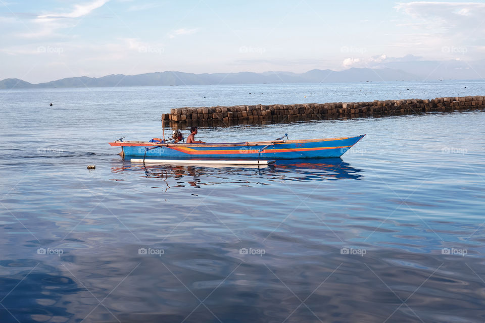 a fisherman returns from the sea