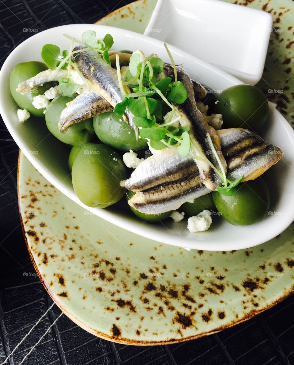 Fresh olive and fish harring salad