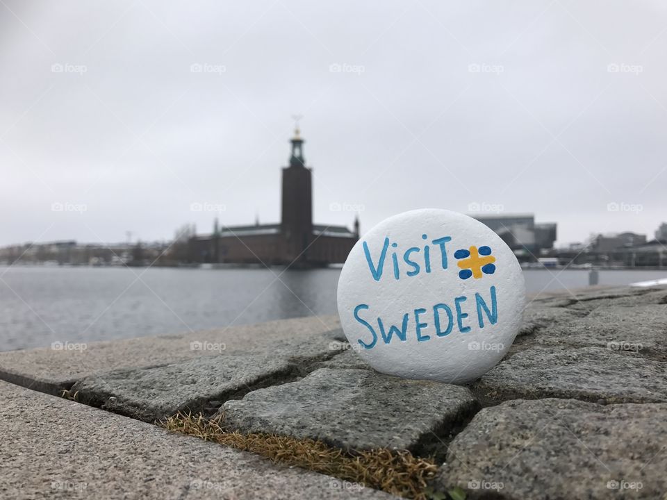 Visit Sweden text on white stone