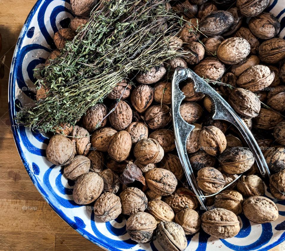 Bowl with walnuts and a nutcracker 