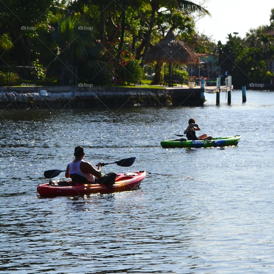 couple kayaking . couple kayaking with manatee in Fort Lauderdale