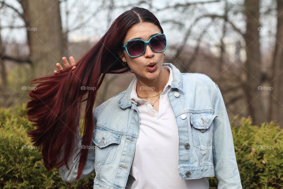 Stylish young woman with a long healthy hair