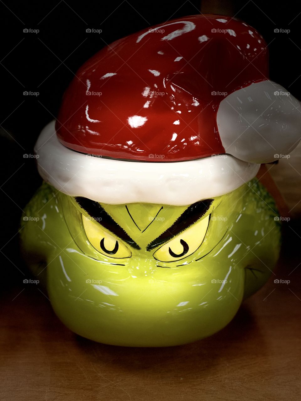 “The Grinch” This is just the head of a grinch of porcelain with a Christmas hat. The 2020 woke up the grinch inside of me. 