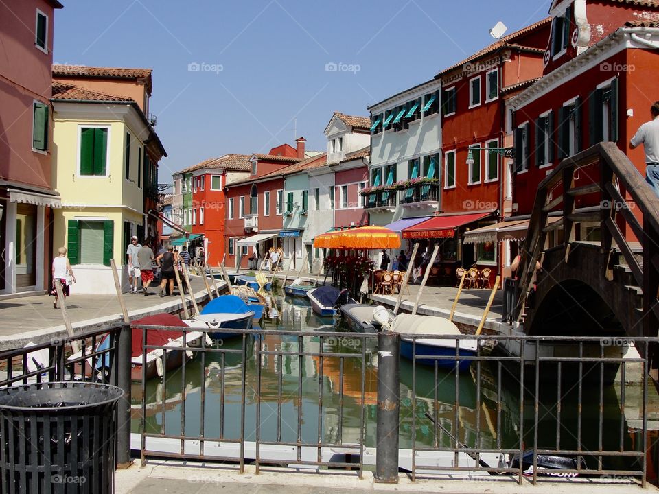 Picturesque Burano is an island in the Venetian Lagoon, northern Italy, near Torcello at the northern end of the Lagoon, known for its lace work and brightly coloured homes.