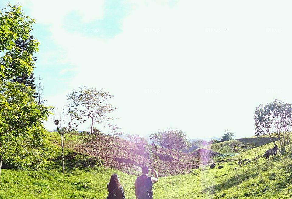Here are my friends looking at the view of a meadow in the rural areas of Talamban, Cebu City Philippines.