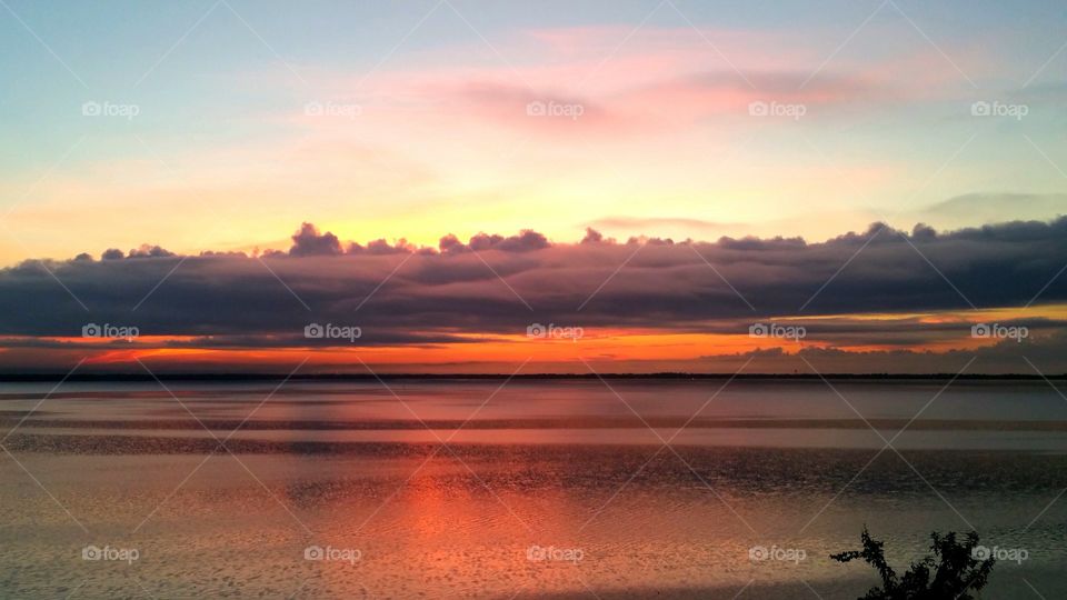 Dramatic sky over lake at dusk