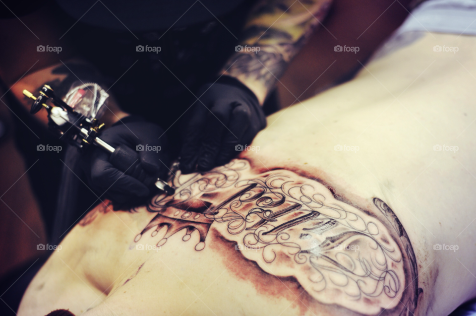 tattoo ink glove tattooing by khookphoto
