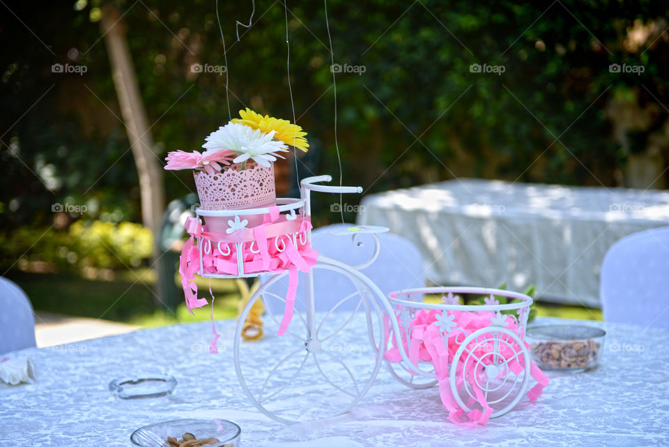 a bicycle with flower center piece on a table