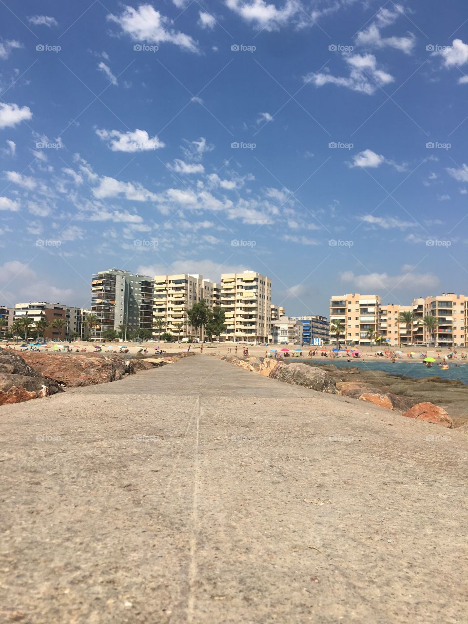  Castellón beach where nature and the city are Face to face. This walk cement walkway stretched to meet the coarse sand and board walk.  