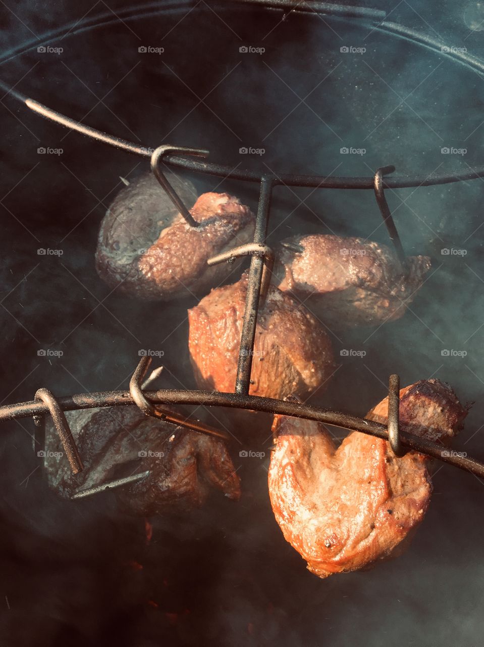 Picanha hanging in smoker