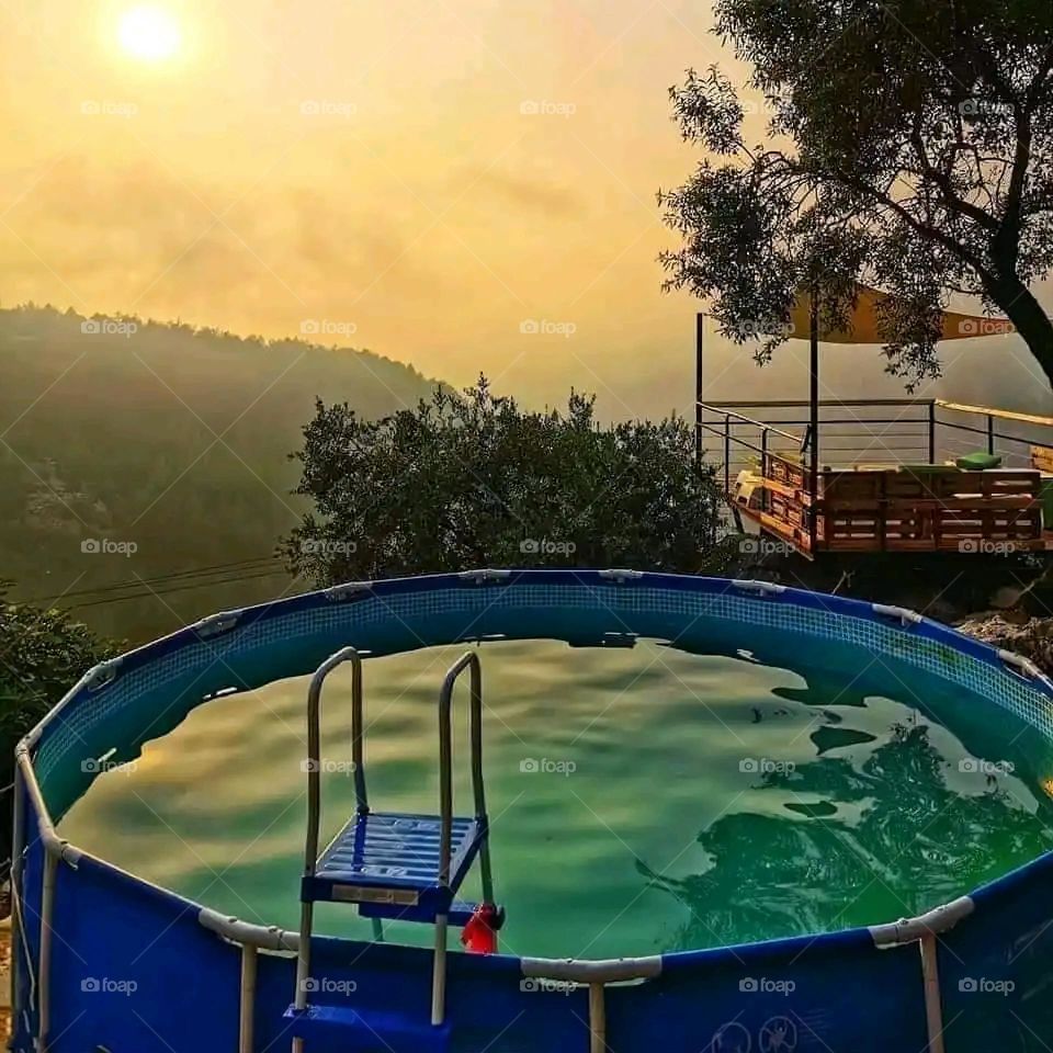 Glory be to God, the magnificent and picturesque view and the natural green trees are a view that is nothing more wonderful than it