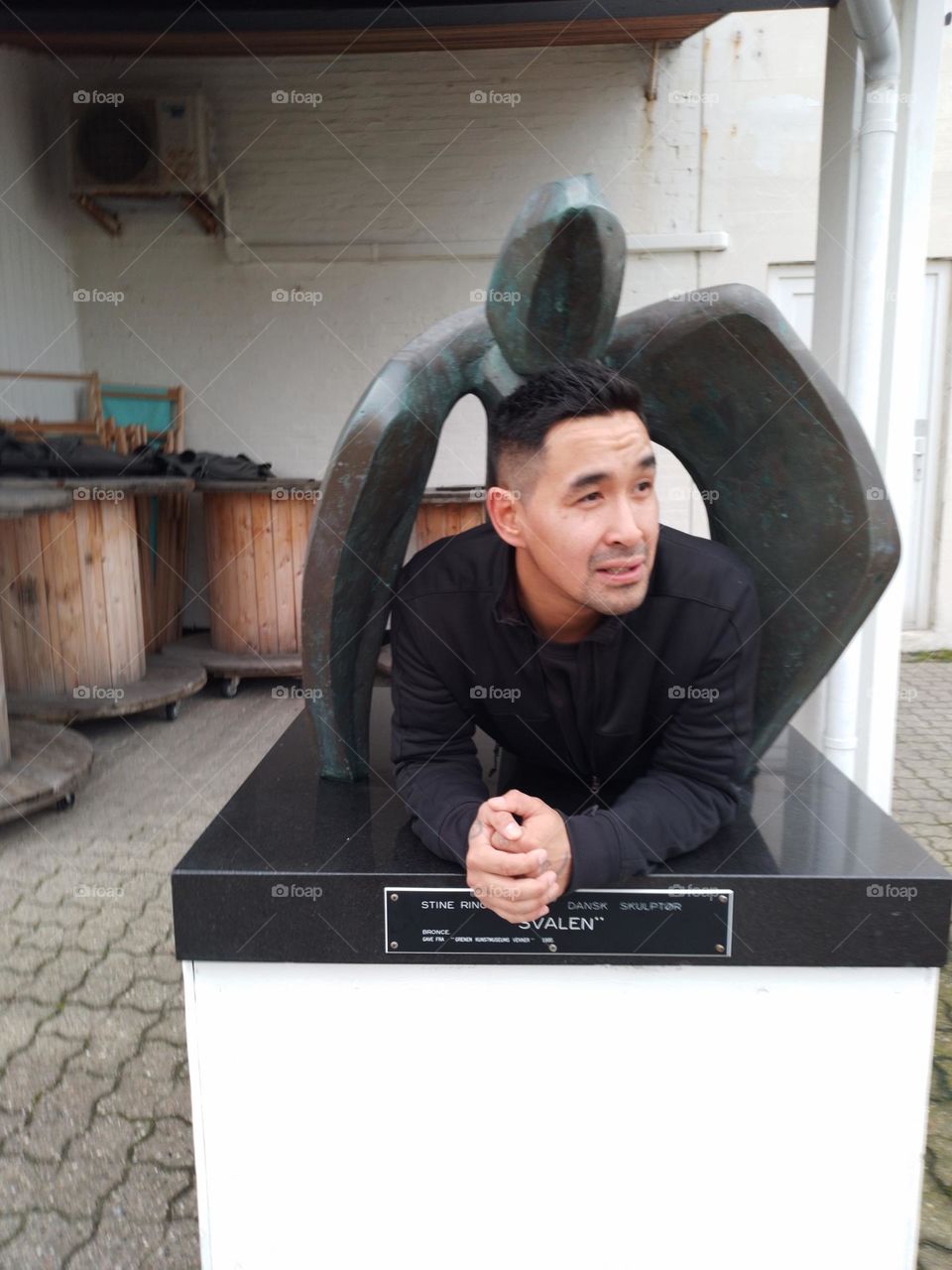 under the statue in DK