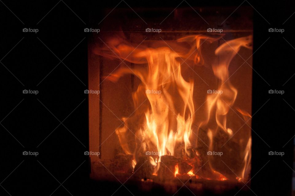 The fire is burning in the fireplace.  Heat supply. Heating. Warm. Background 