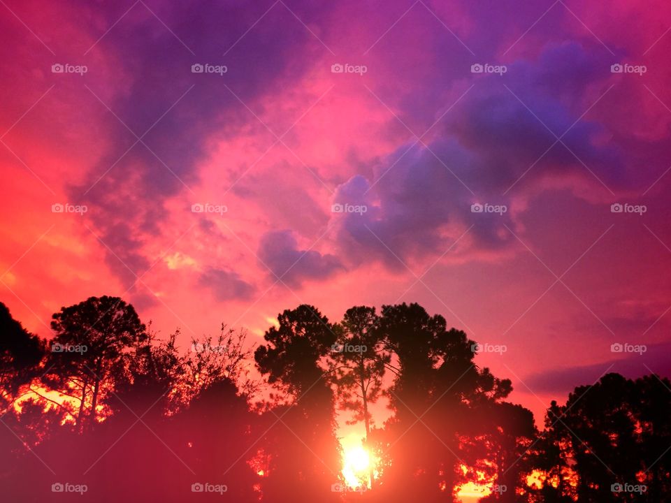 Vivid multicolored sunset. Vivid sunset before a nighttime storm.