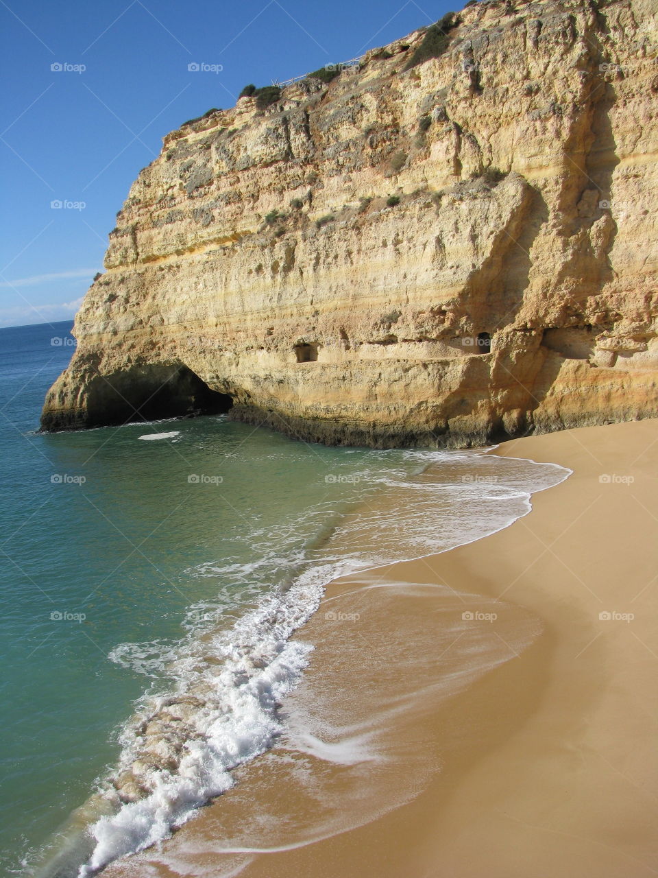 Algarve beach with old tunnel in the cliffs