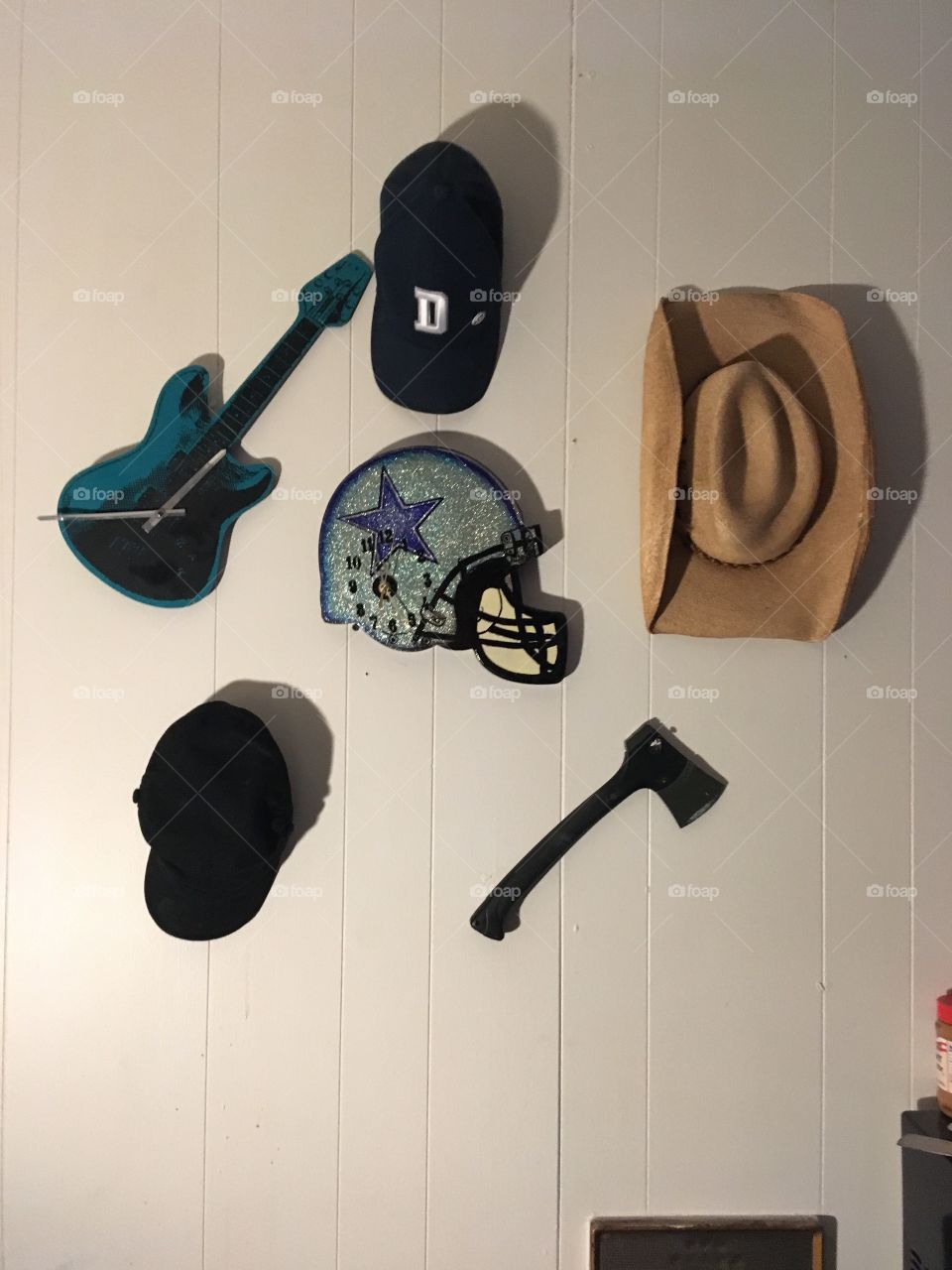 I put this onsomble together while staying at a motel where I was working, I made the Dallas Cowboys clock but the Cowboys hats and hatchet were given to me 