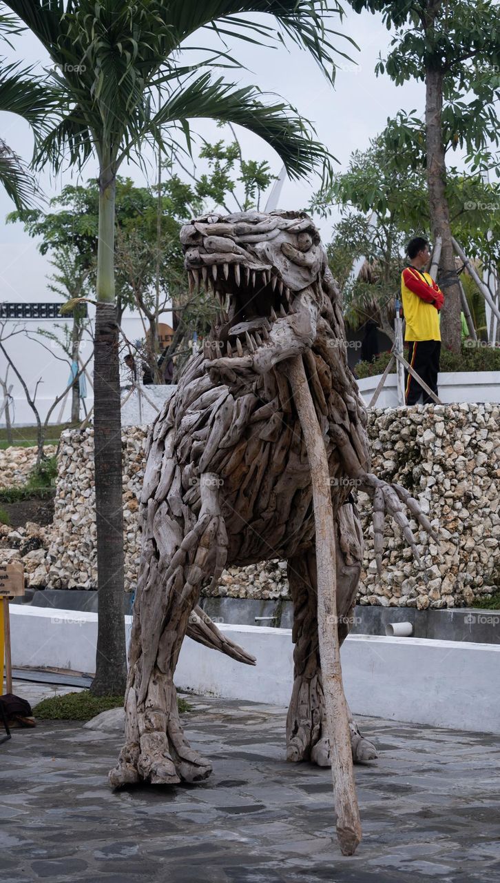artwork dinosaur made from wood