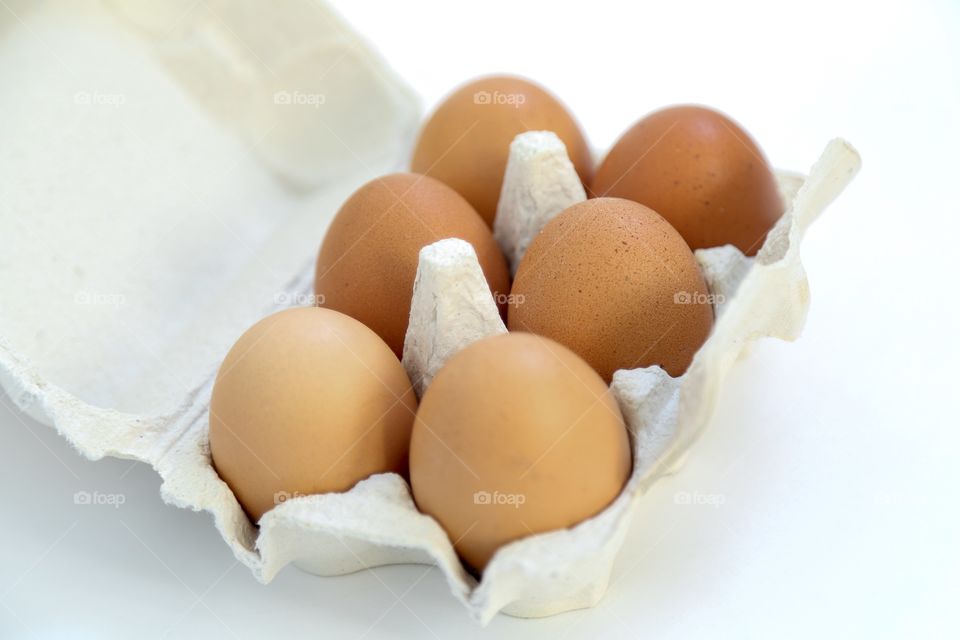 Eggs in the box on white background