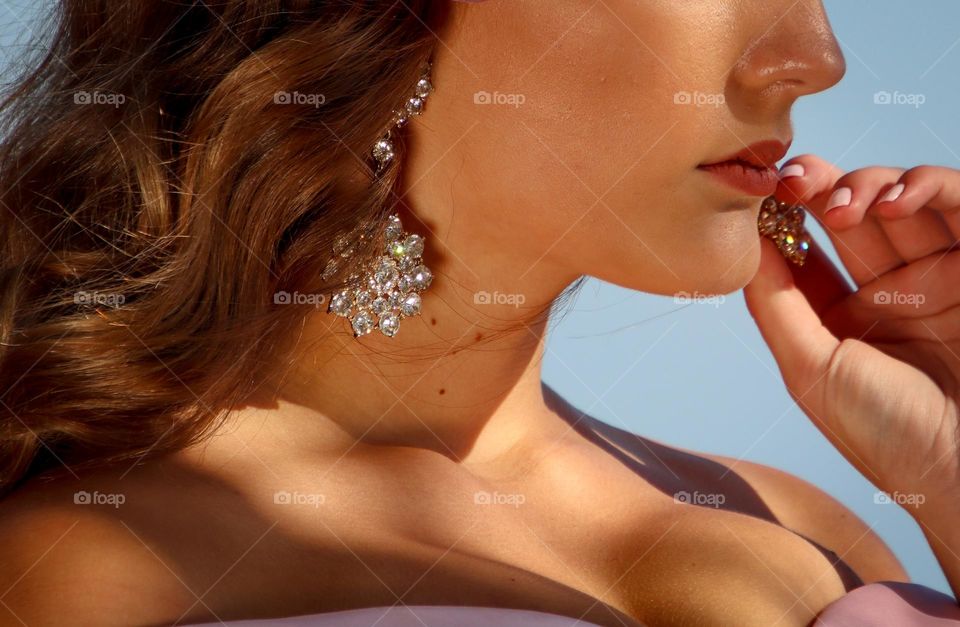 Beautiful woman with gorgeous  sparkling earrings on