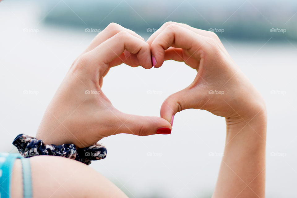 heart shape hands. heart shape made of girls hands