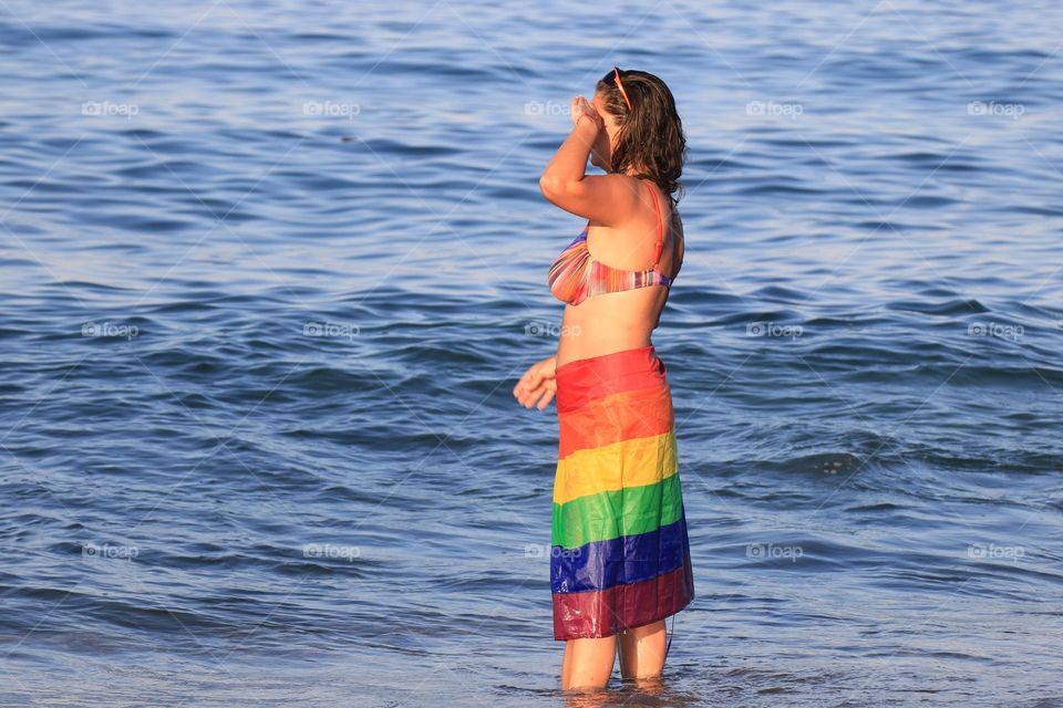 Woman wearing a gay flag 