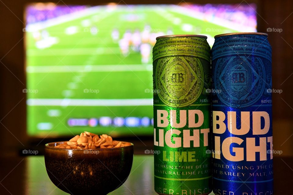 Watching football with Bud Light beer