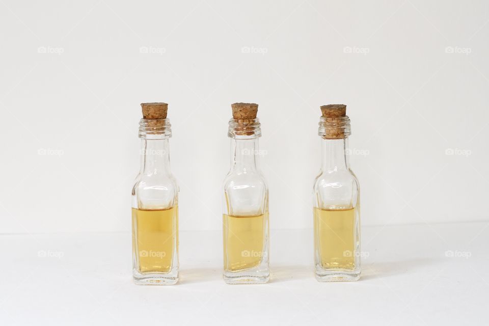 bottles with a golden liquid